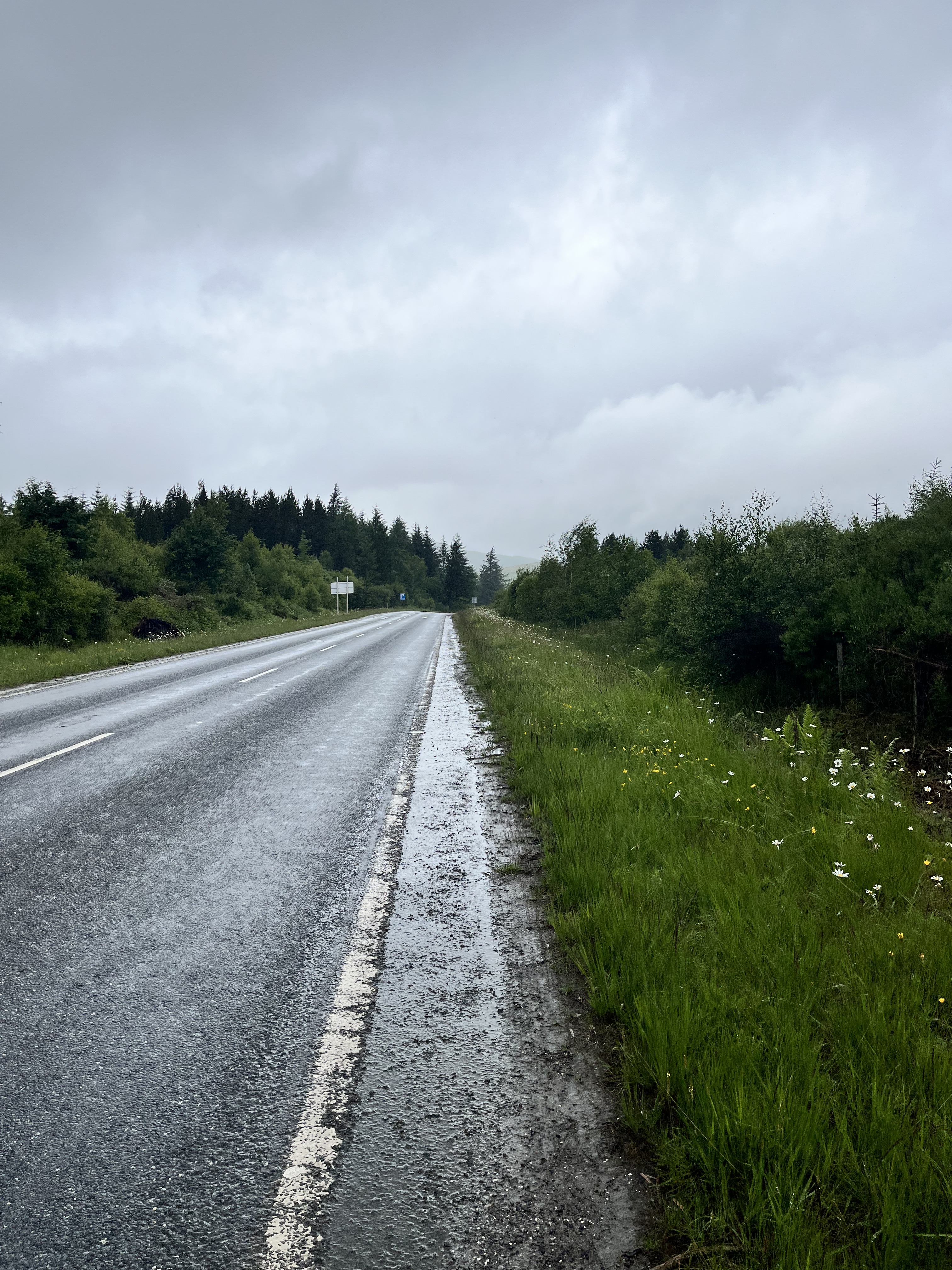 Side of the road with heavy clouds above when I got lost on East Highland Way